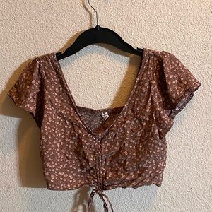 Cropped floral adjustable blouse from Garage, size medium,good condition